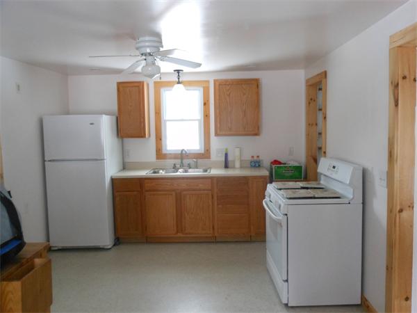 122 Huntington Road Russell, MA 01071 - Photo 3 of 16 a kitchen with a refrigerator sink stove and cabinets