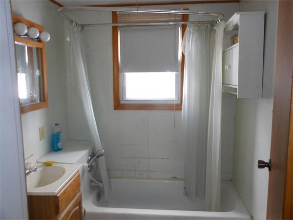 122 Huntington Road Russell, MA 01071 - Photo 10 of 16 a bathroom with a bathtub and a window