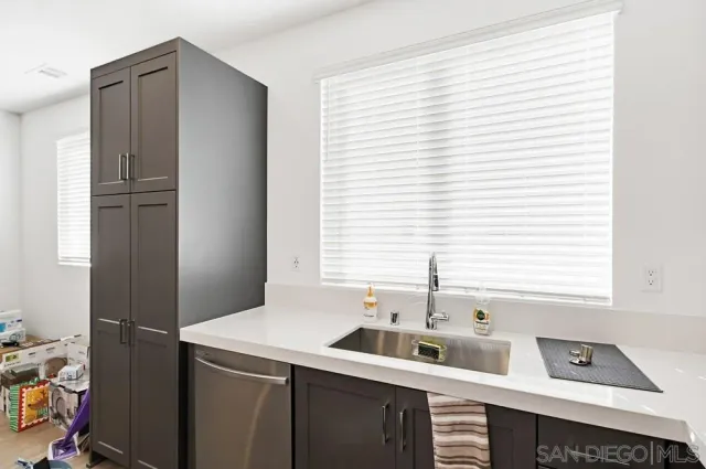 a room with a window and a sink