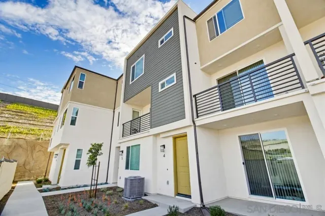 a front view of a building with many windows