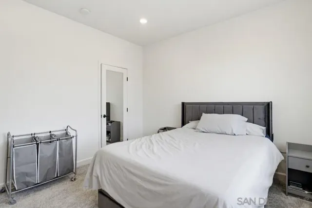 a bedroom with a bed and a cabinets