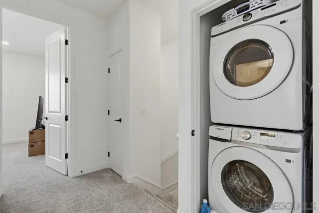 a view of a storage & utility room with washer and dryer