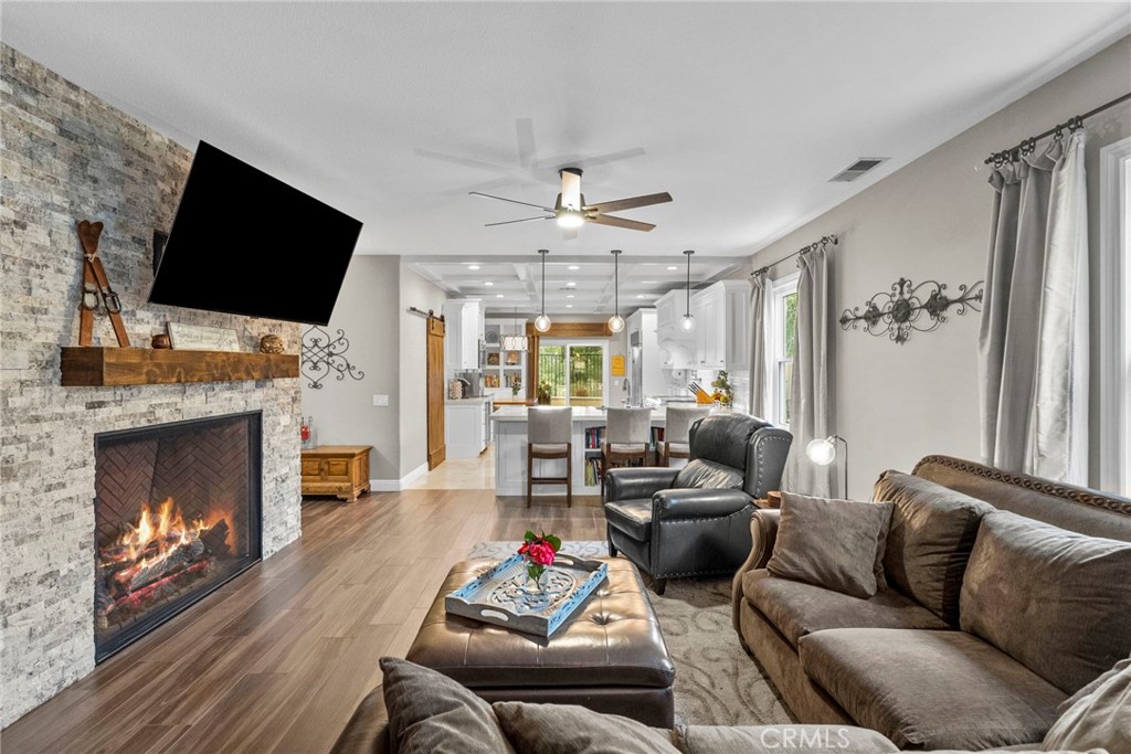 29859 Cashmere Place Castaic, CA 91384 - Photo 11 of 48 a living room with furniture a flat screen tv and a fireplace