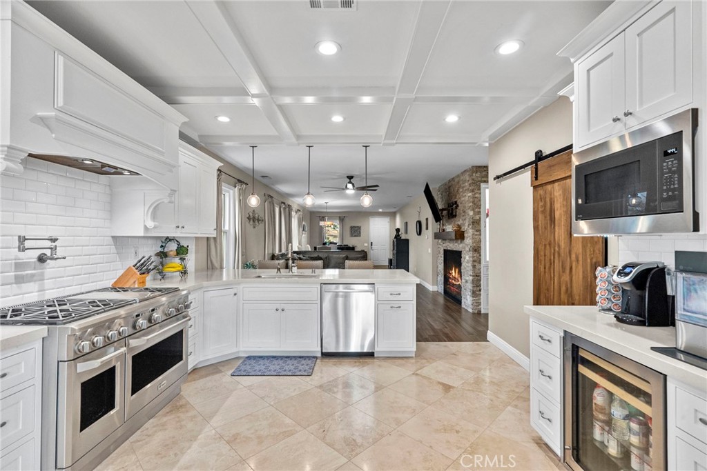 29859 Cashmere Place Castaic, CA 91384 - Photo 12 of 48 a kitchen with stainless steel appliances granite countertop a sink dishwasher stove and refrigerator