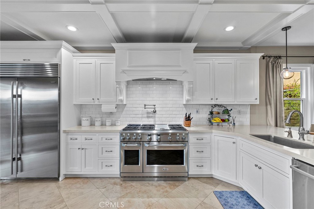 29859 Cashmere Place Castaic, CA 91384 - Photo 14 of 48 a kitchen with cabinets stainless steel appliances and a window