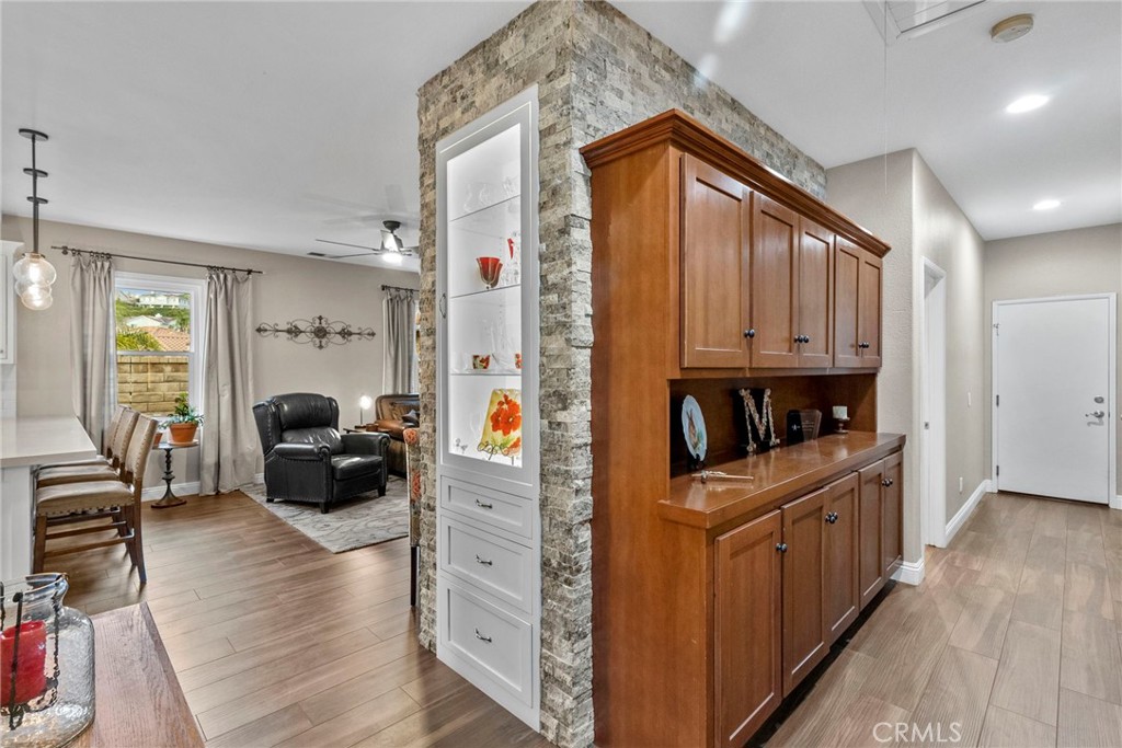 29859 Cashmere Place Castaic, CA 91384 - Photo 19 of 48 a kitchen with cabinets and wooden floor