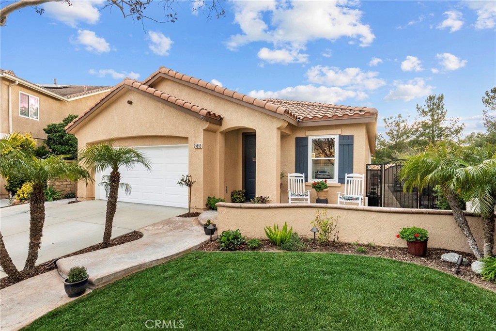 29859 Cashmere Place Castaic, CA 91384 - Photo 2 of 48 front view of house with a yard and potted plants