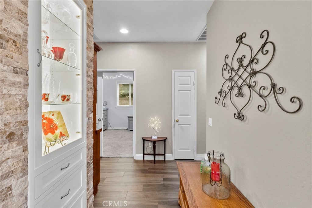29859 Cashmere Place Castaic, CA 91384 - Photo 25 of 48 wooden floor with an entryway and a couch