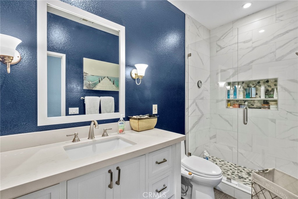29859 Cashmere Place Castaic, CA 91384 - Photo 27 of 48 a bathroom with a granite countertop sink toilet and shower