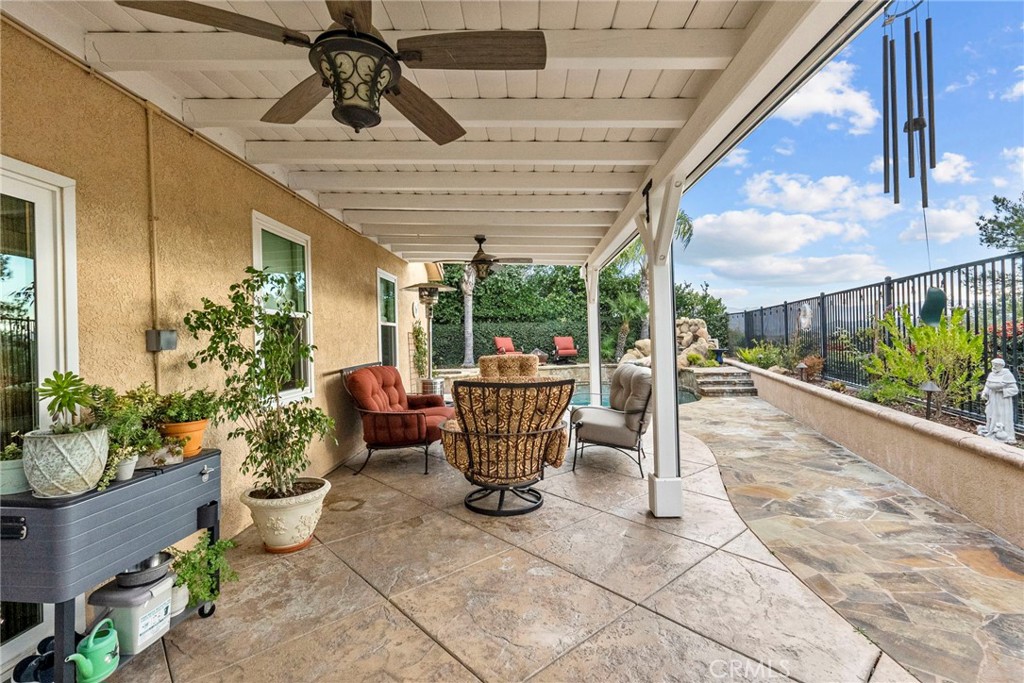 29859 Cashmere Place Castaic, CA 91384 - Photo 35 of 48 a patio with table and chairs potted plants