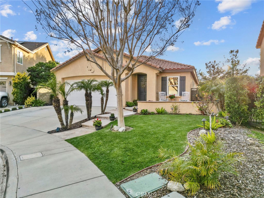29859 Cashmere Place Castaic, CA 91384 - Photo 48 of 48 a front view of a house with garden
