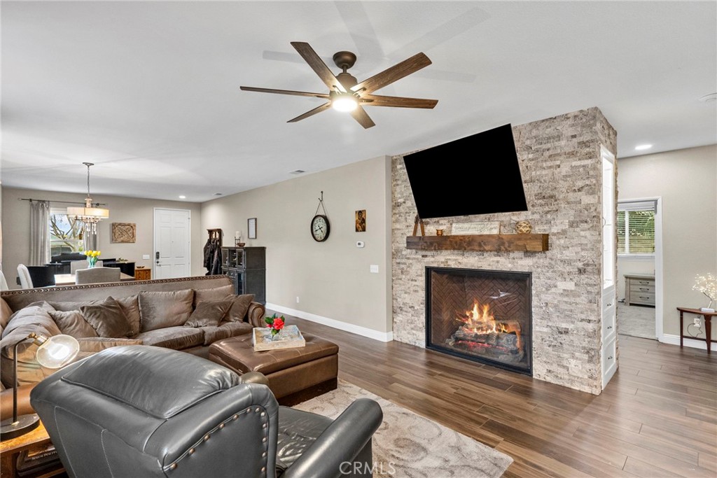 29859 Cashmere Place Castaic, CA 91384 - Photo 9 of 48 a living room with furniture a fireplace and a flat screen tv