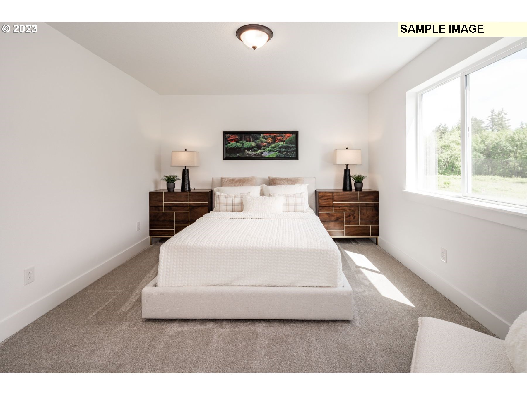 17535 Northwest 7th Avenue Ridgefield, WA 98642 - Photo 11 of 32 a bedroom with a bed and a large window