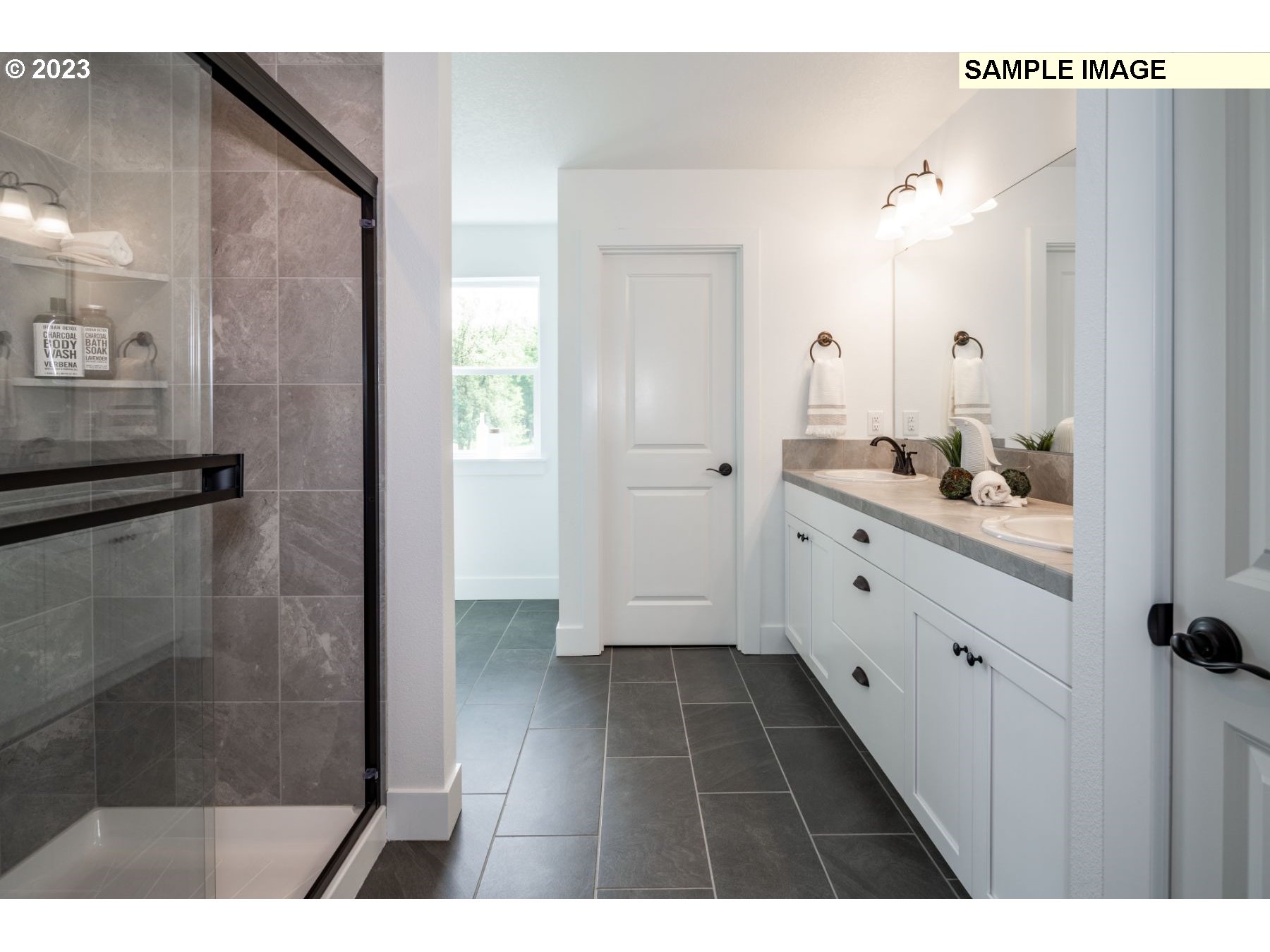 17535 Northwest 7th Avenue Ridgefield, WA 98642 - Photo 12 of 32 a bathroom with a double vanity sink a toilet a mirror and shower