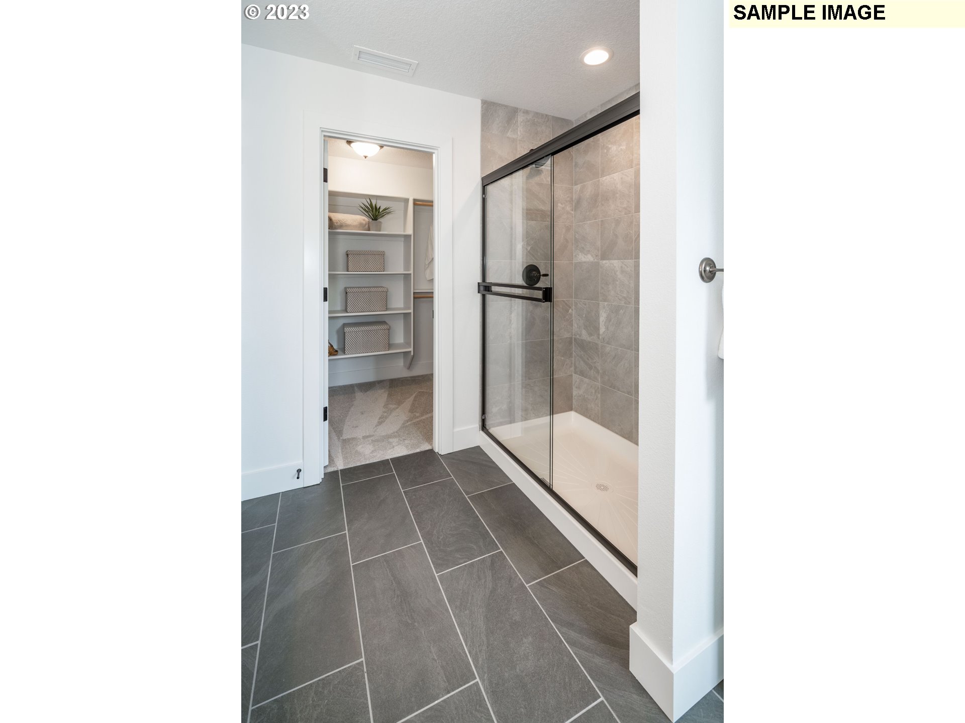 17535 Northwest 7th Avenue Ridgefield, WA 98642 - Photo 14 of 32 a bathroom with a glass shower door and a bathtub