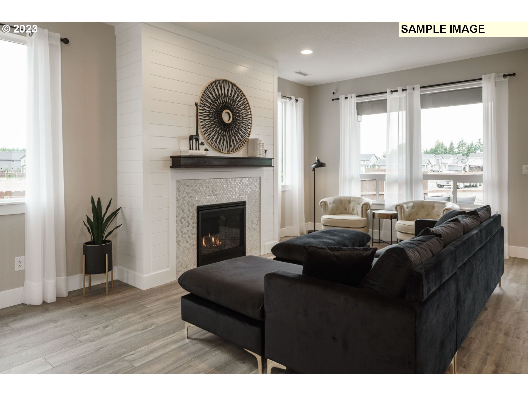 17535 Northwest 7th Avenue Ridgefield, WA 98642 - Photo 21 of 32 a living room with furniture and a fireplace