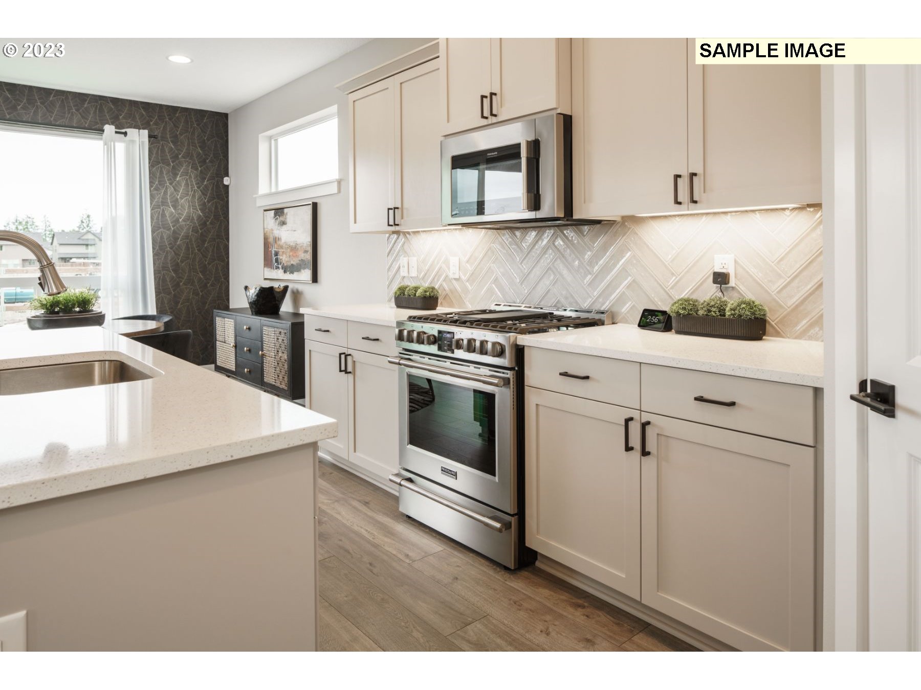 17535 Northwest 7th Avenue Ridgefield, WA 98642 - Photo 23 of 32 a kitchen with appliances cabinets and a sink