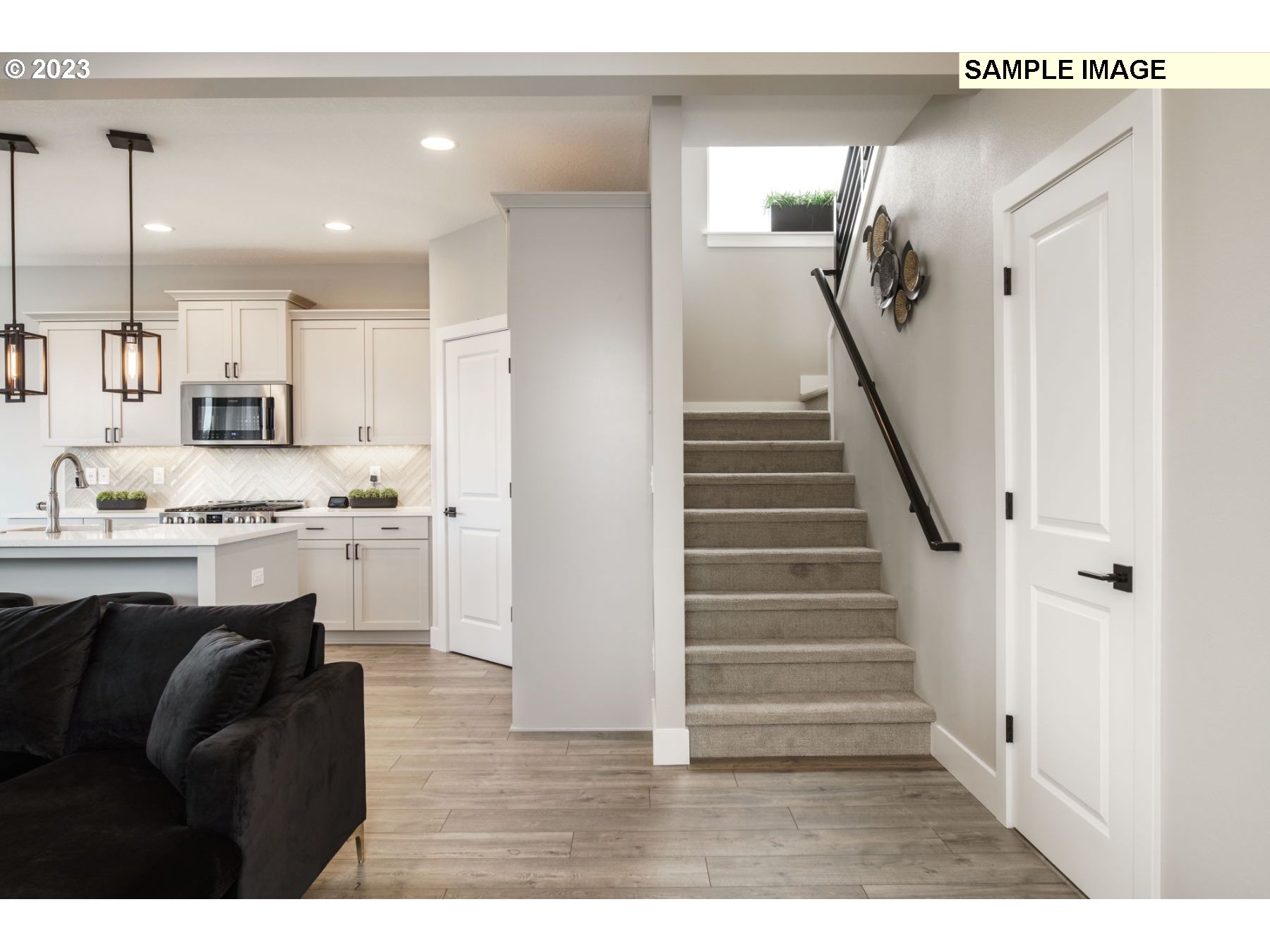 17535 Northwest 7th Avenue Ridgefield, WA 98642 - Photo 27 of 32 a living room with stainless steel appliances kitchen island granite countertop furniture and a view of kitchen