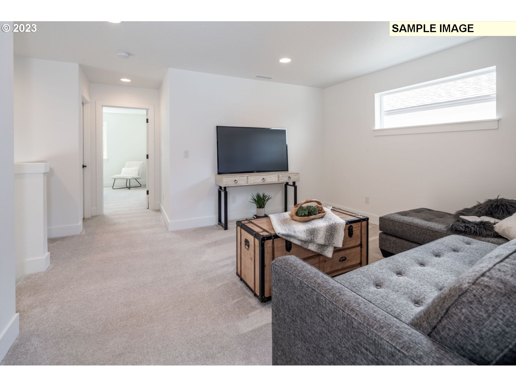17535 Northwest 7th Avenue Ridgefield, WA 98642 - Photo 10 of 32 a living room with furniture and a flat screen tv