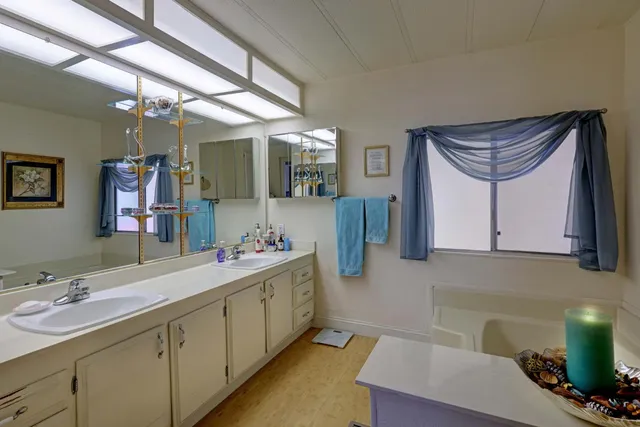 a bathroom with a sink and mirror