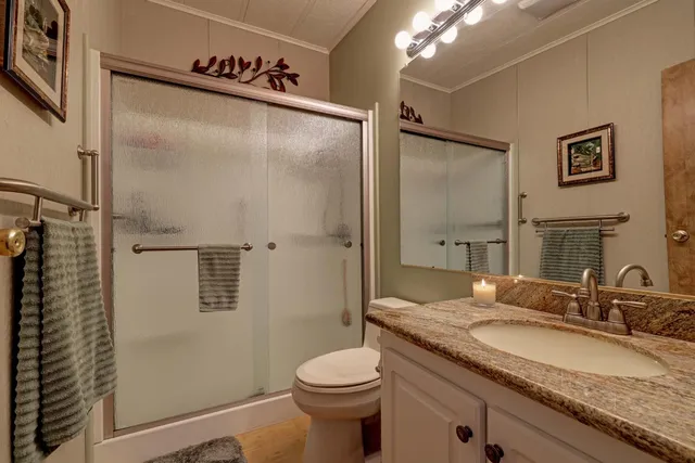 a view of a livingroom with workspace and a couch