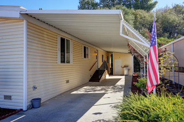 a view of a tree front of house