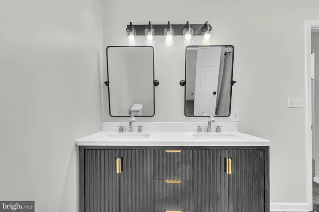 an empty room with a ceiling fan and a window