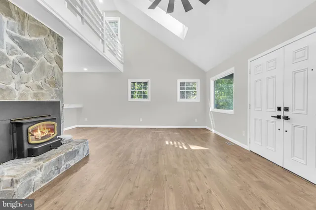 a view of a livingroom with a ceiling fan and window