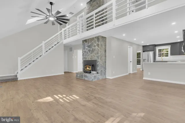 a kitchen with a sink stainless steel appliances and cabinets
