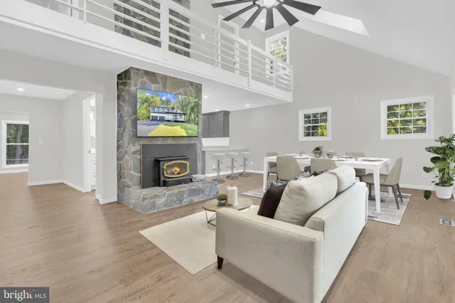 a kitchen with granite countertop a refrigerator stove top oven and sink