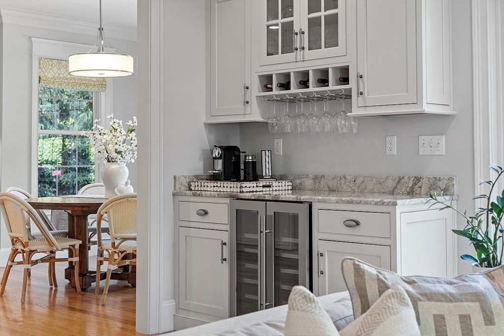 25 Shade Street Lexington, MA 02421 - Photo 11 of 42 a kitchen with stainless steel appliances granite countertop a white cabinets and a stove