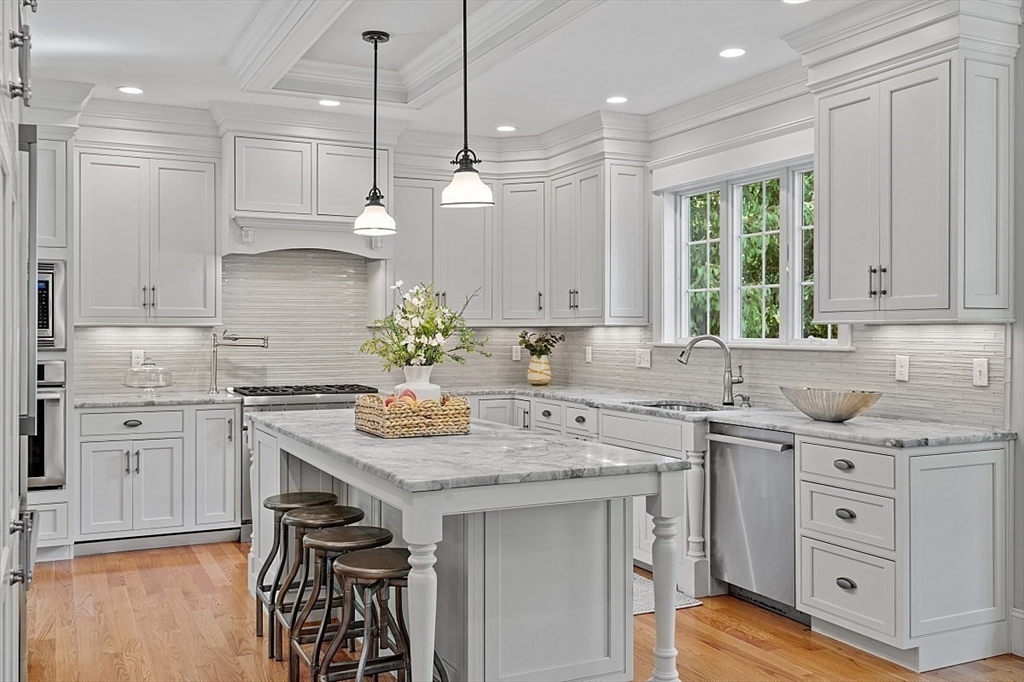 25 Shade Street Lexington, MA 02421 - Photo 14 of 42 a kitchen with a sink stove and cabinets