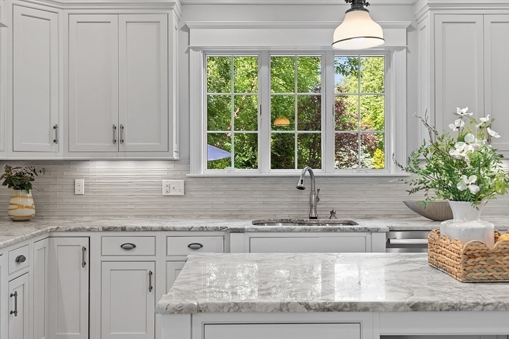 25 Shade Street Lexington, MA 02421 - Photo 15 of 42 a kitchen with granite countertop white cabinets and a window