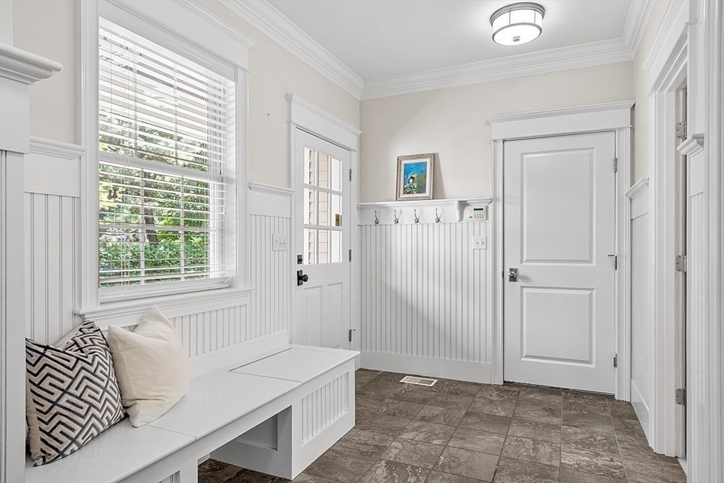25 Shade Street Lexington, MA 02421 - Photo 22 of 42 a living room with a couch and a window