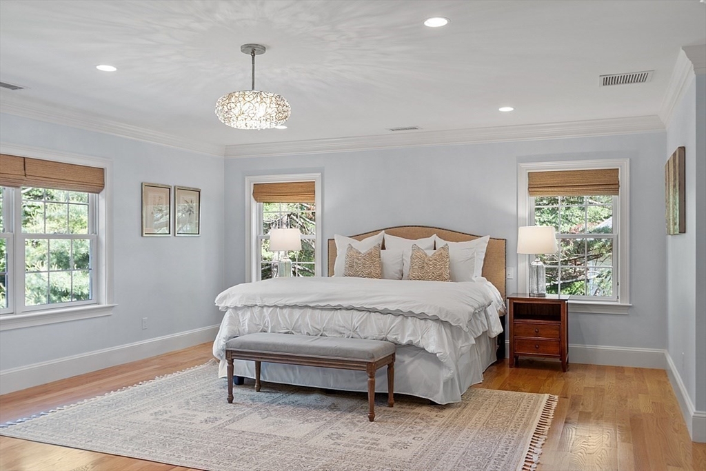 25 Shade Street Lexington, MA 02421 - Photo 25 of 42 a spacious bedroom with a bed and a window