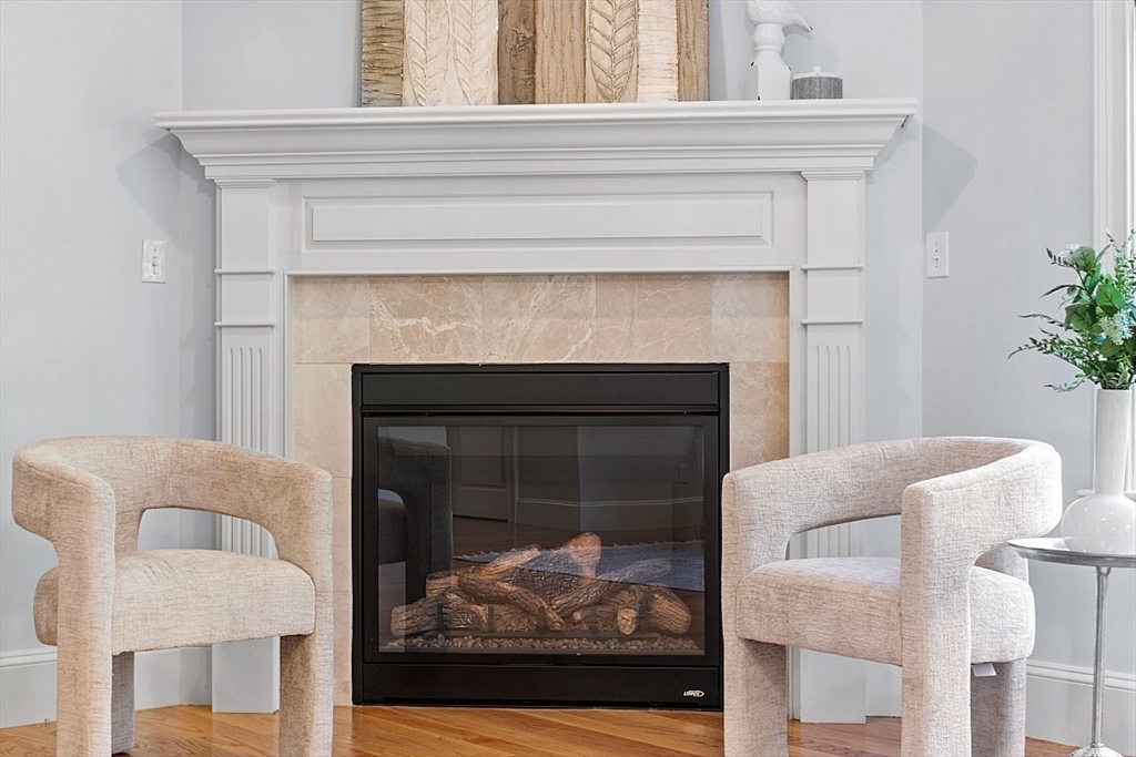 25 Shade Street Lexington, MA 02421 - Photo 26 of 42 a living room with furniture and a fireplace