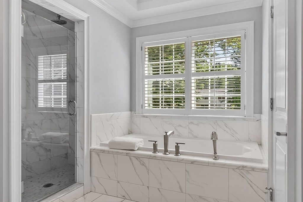 25 Shade Street Lexington, MA 02421 - Photo 28 of 42 a bathroom with a granite countertop sink and a shower