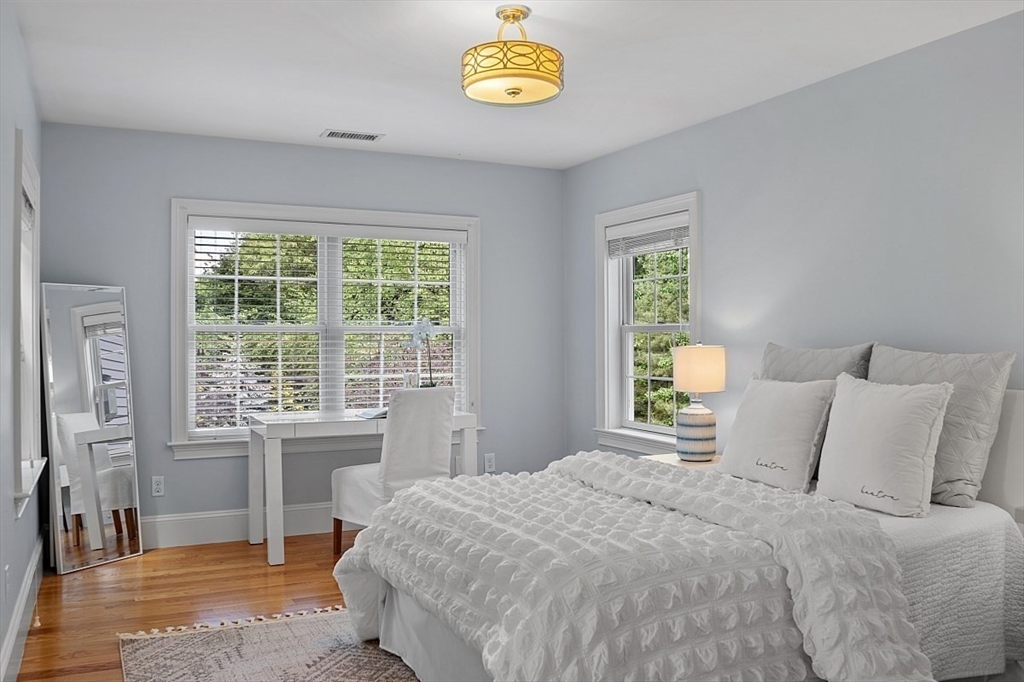 25 Shade Street Lexington, MA 02421 - Photo 30 of 42 a bedroom with a bed and a window