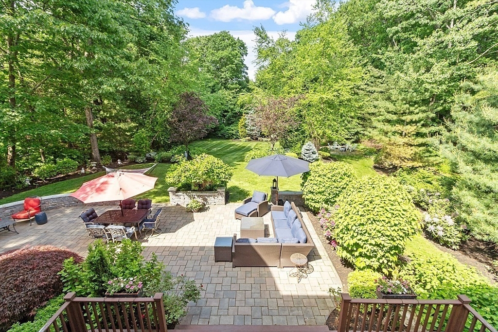 25 Shade Street Lexington, MA 02421 - Photo 3 of 42 an aerial view of a house with a yard basket ball court and outdoor seating