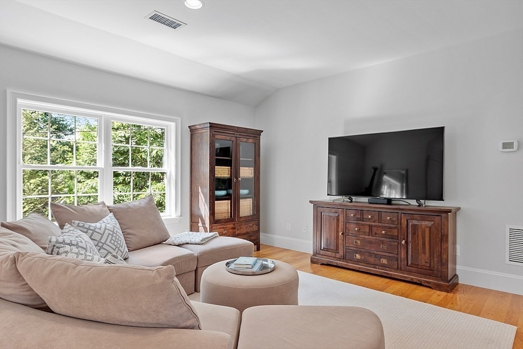 25 Shade Street Lexington, MA 02421 - Photo 35 of 42 a living room with furniture and a flat screen tv
