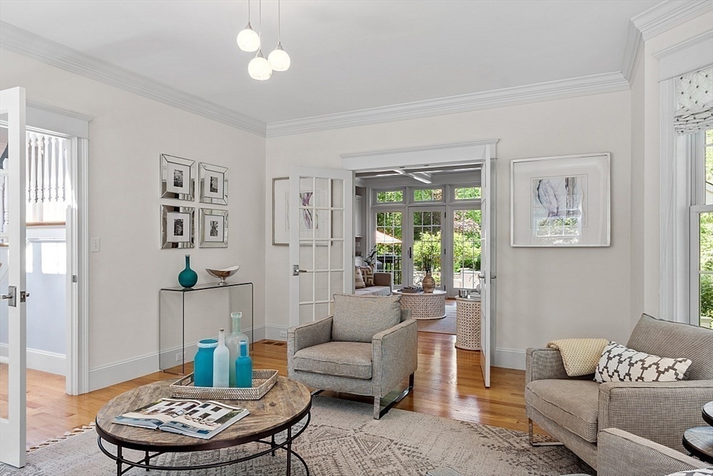 25 Shade Street Lexington, MA 02421 - Photo 7 of 42 a living room with furniture and a chandelier