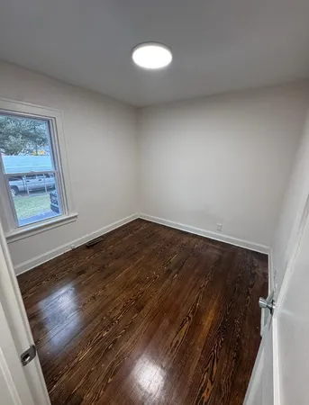 a view of an empty room and window