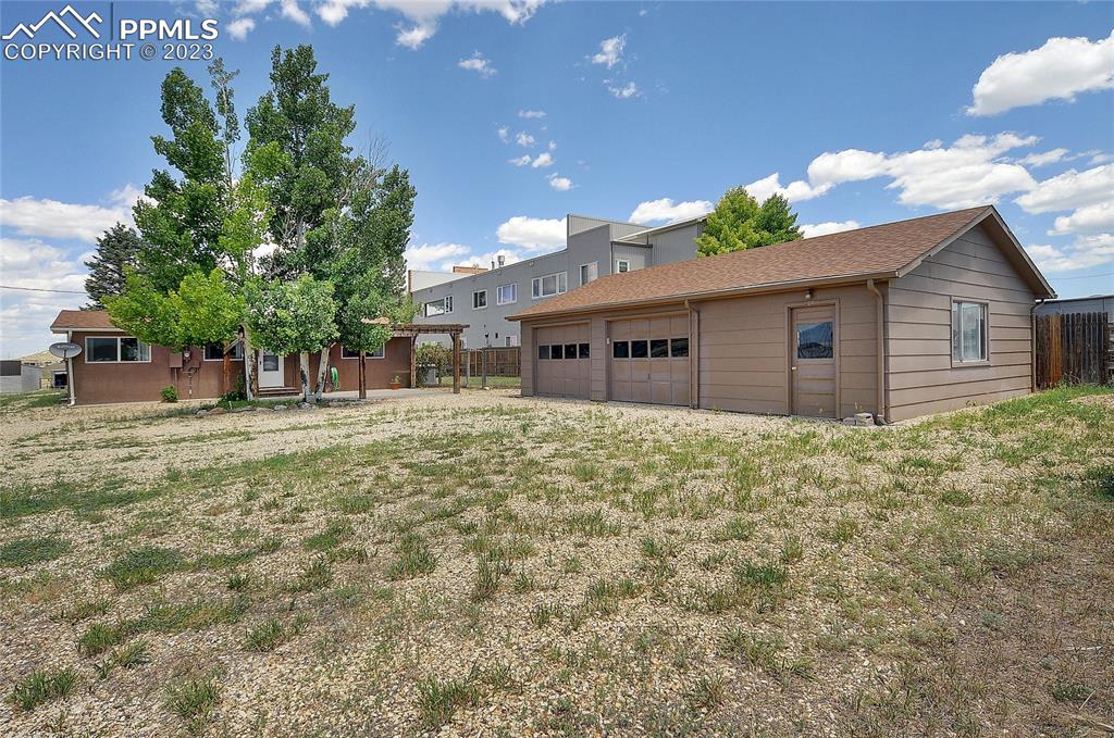 20 Main Street Silver Cliff, CO 81252 - Photo 1 of 28 a front view of a house with a garden