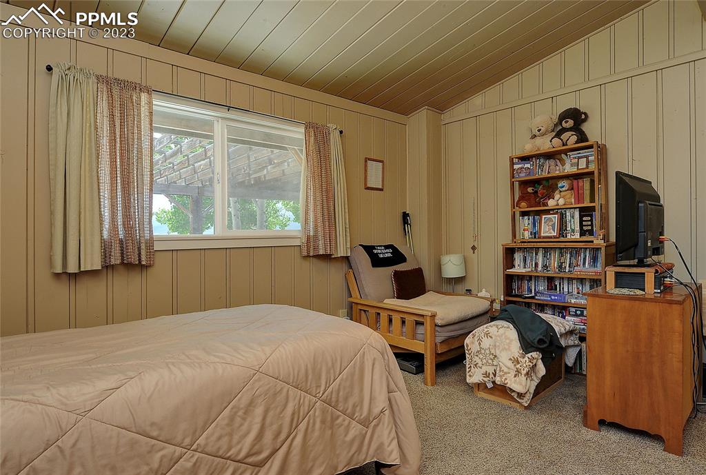 20 Main Street Silver Cliff, CO 81252 - Photo 14 of 28 a bedroom with a bed furniture and a window