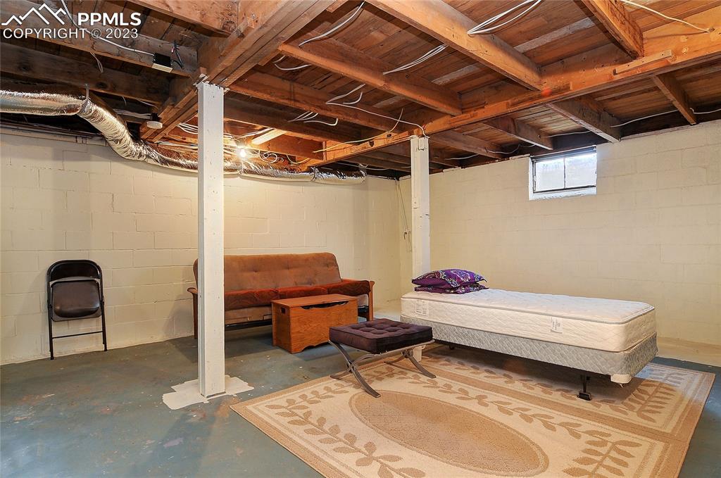 20 Main Street Silver Cliff, CO 81252 - Photo 16 of 28 a room with a chair and white walls