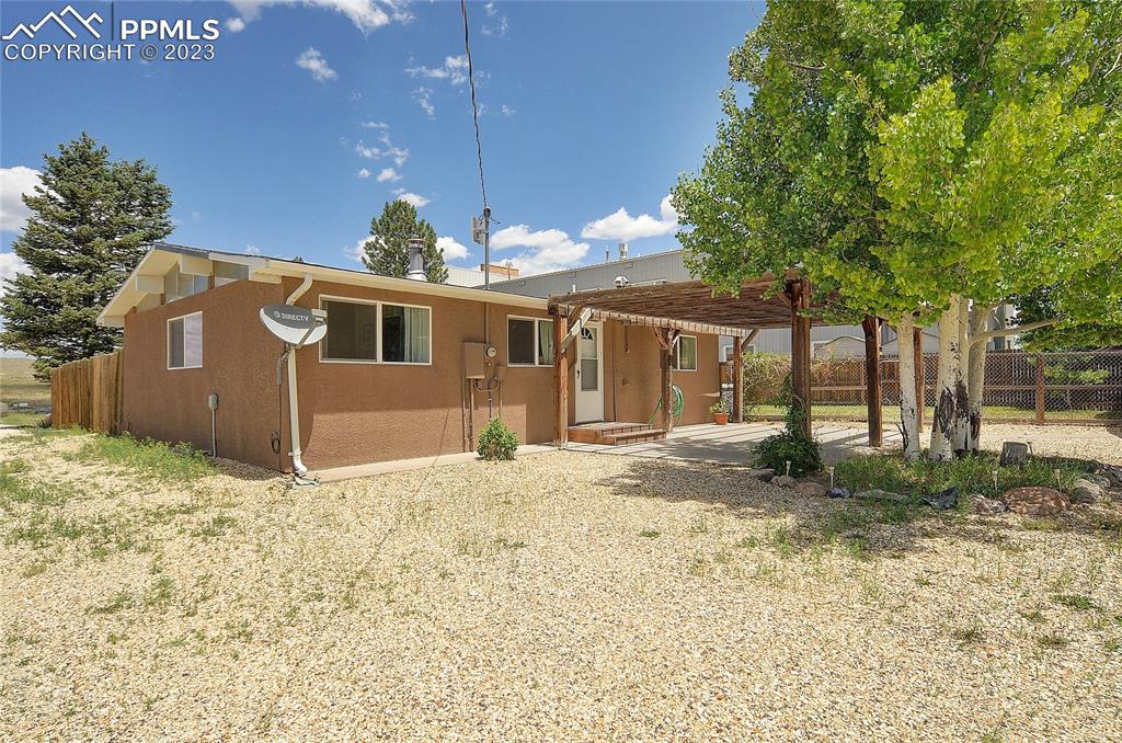 20 Main Street Silver Cliff, CO 81252 - Photo 23 of 28 a front view of a house with a yard and garage