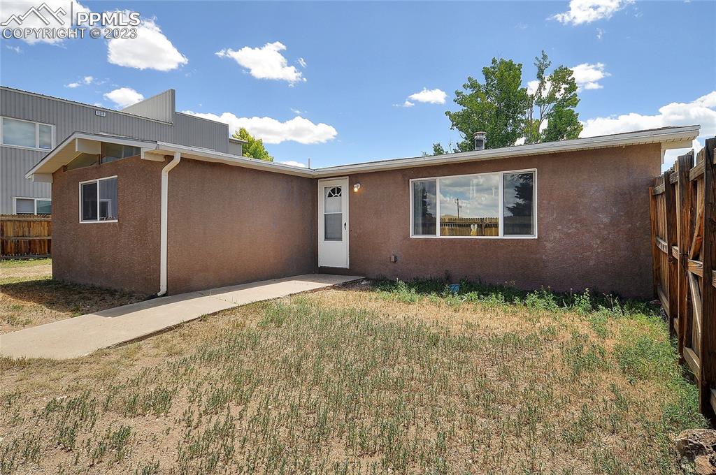 20 Main Street Silver Cliff, CO 81252 - Photo 24 of 28 a house with trees in the background