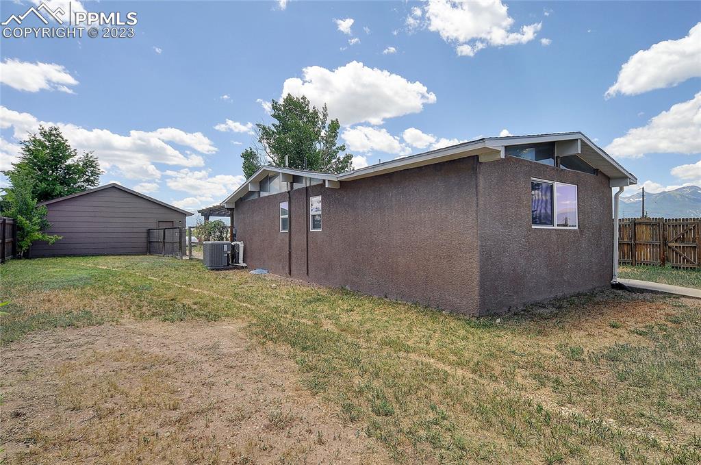20 Main Street Silver Cliff, CO 81252 - Photo 25 of 28 a front view of a house with a yard and garage