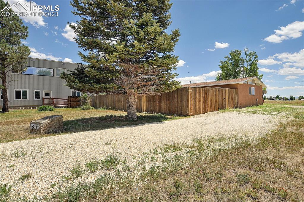 20 Main Street Silver Cliff, CO 81252 - Photo 26 of 28 a view of a yard with wooden fence