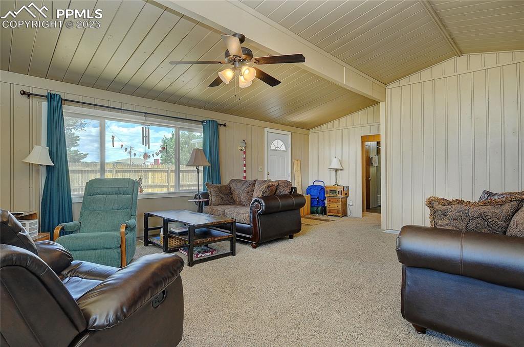 20 Main Street Silver Cliff, CO 81252 - Photo 8 of 28 a living room with furniture and a large window